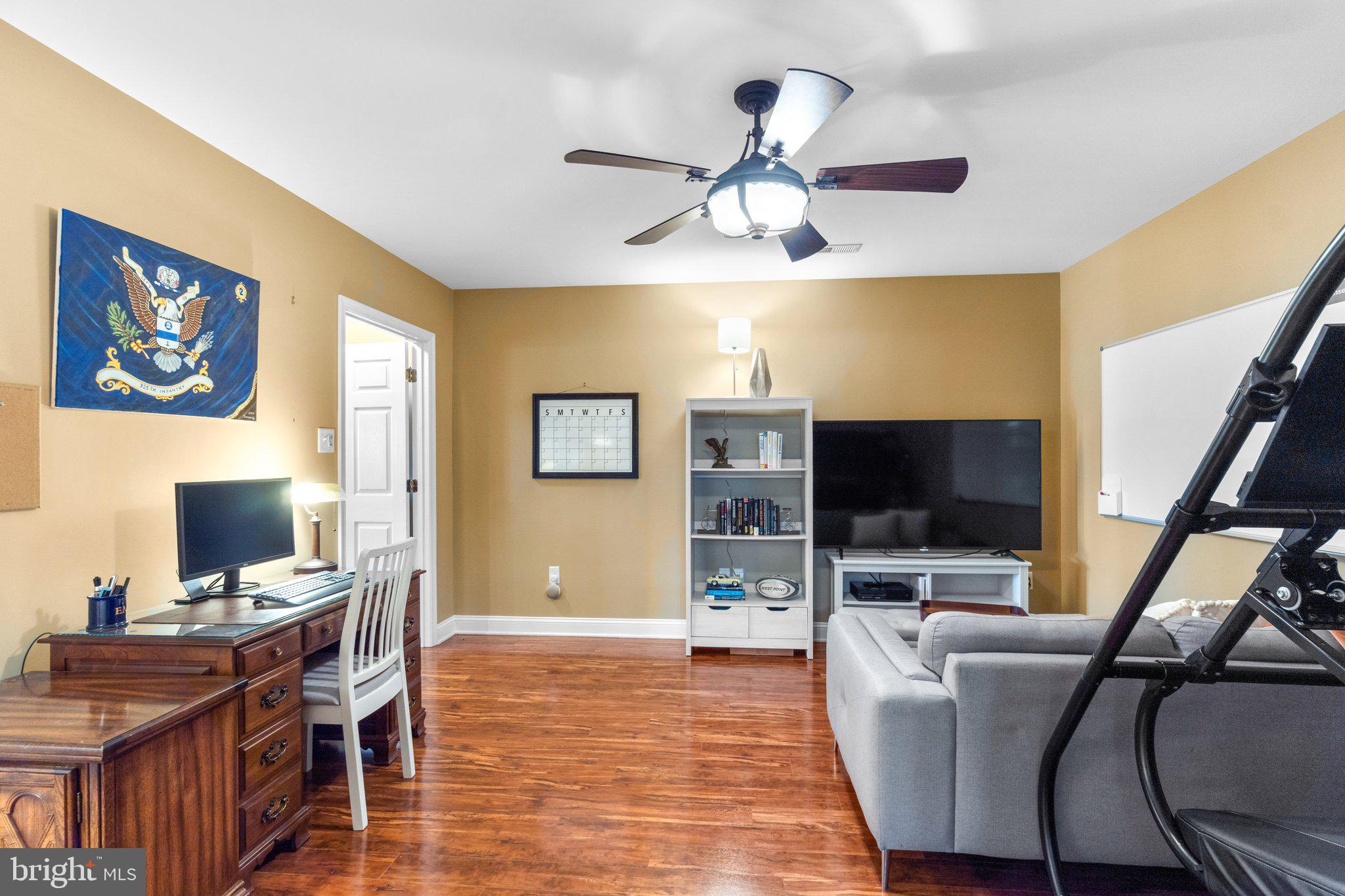 7341 Kehne Road Frederick, MD 21702 - Photo 45 of 67 a view of a livingroom with furniture and a flat screen tv