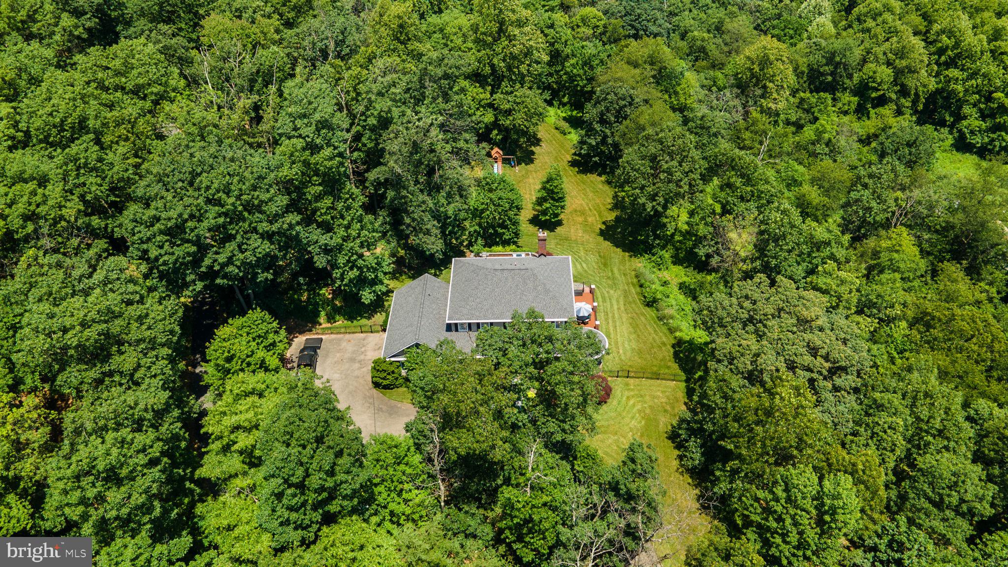 7341 Kehne Road Frederick, MD 21702 - Photo 64 of 67 an aerial view of residential house with outdoor space and trees all around
