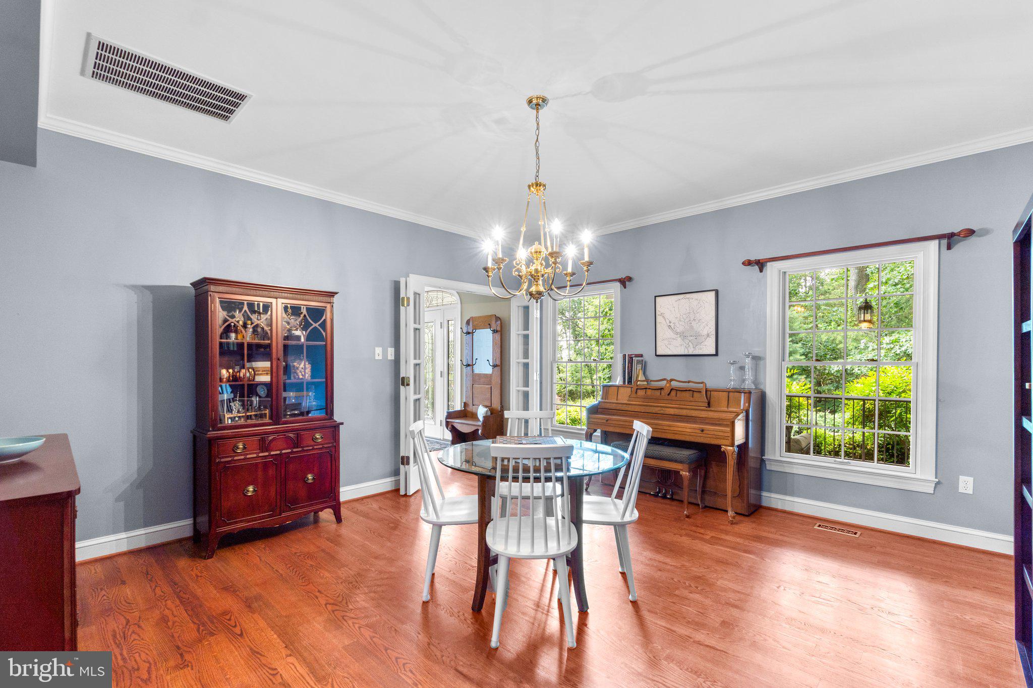7341 Kehne Road Frederick, MD 21702 - Photo 7 of 67 a dining room with furniture window wooden floor and a chandelier