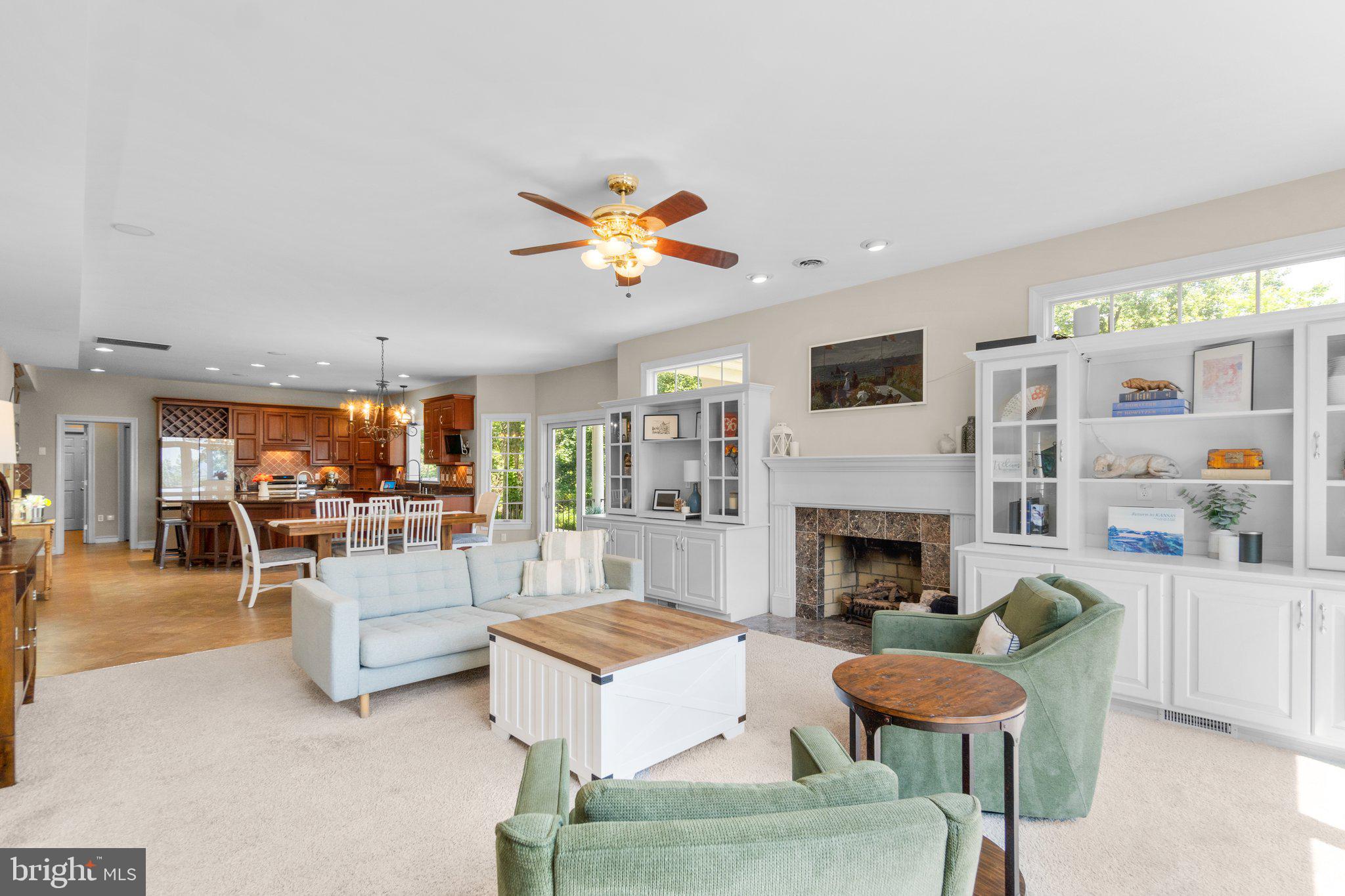 7341 Kehne Road Frederick, MD 21702 - Photo 10 of 67 a living room with furniture a fireplace and a flat screen tv