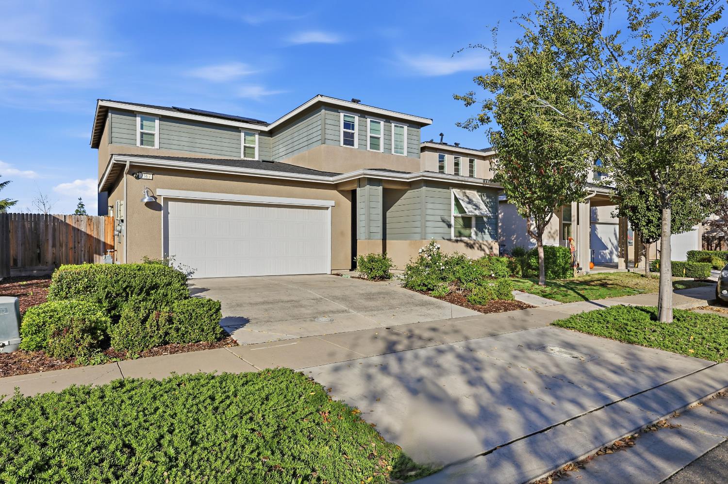2367 Explorador Drive Merced, CA 95340 - Photo 1 of 42 a front view of a house with a yard and garage