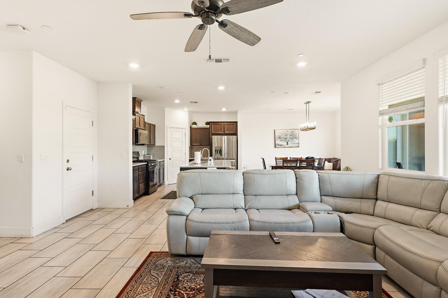 2367 Explorador Drive Merced, CA 95340 - Photo 12 of 42 a living room with furniture and a view of kitchen