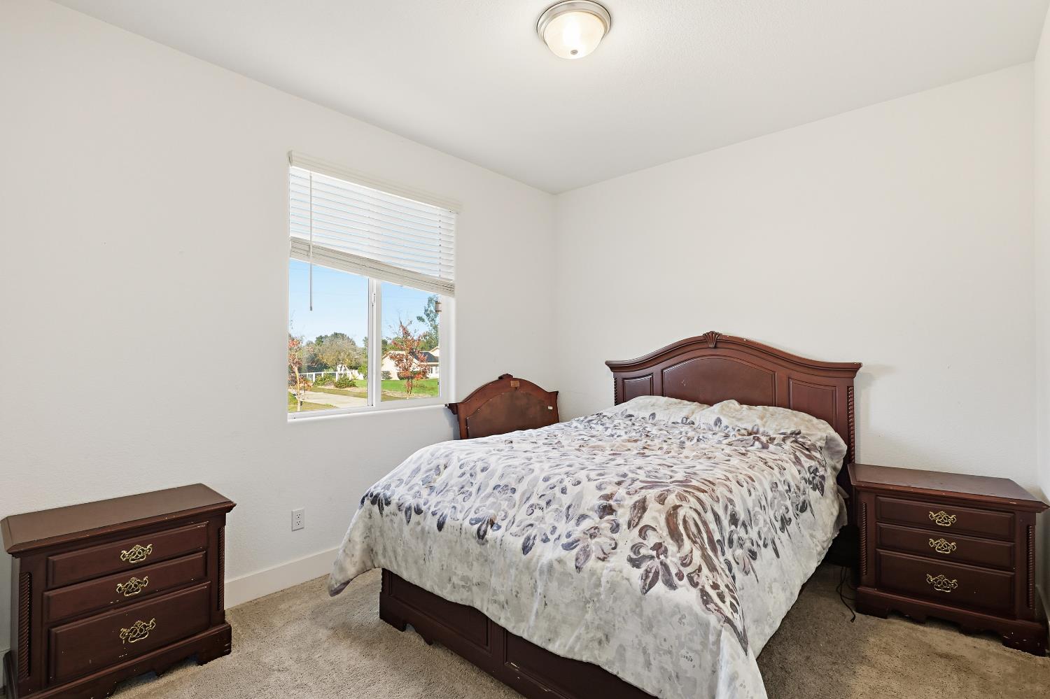 2367 Explorador Drive Merced, CA 95340 - Photo 24 of 42 a bedroom with a bed and a dresser