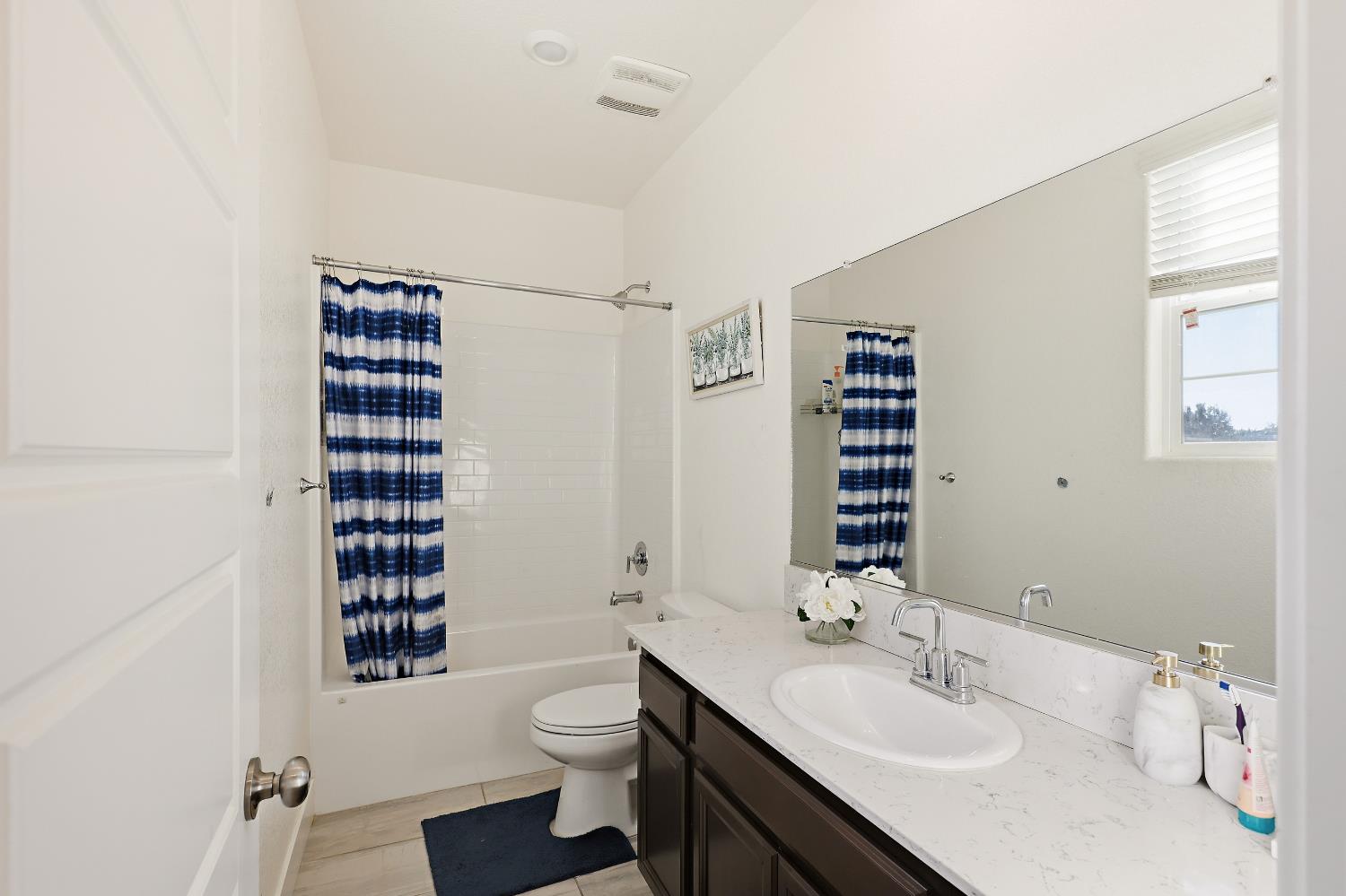 2367 Explorador Drive Merced, CA 95340 - Photo 28 of 42 a bathroom with a sink a toilet and shower