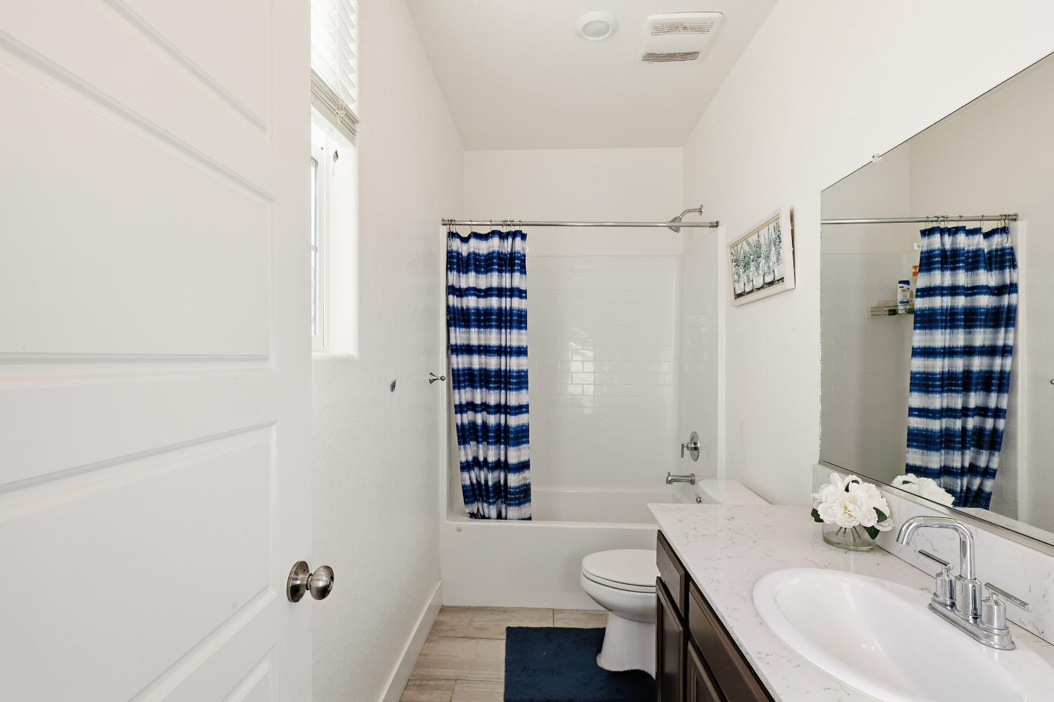 2367 Explorador Drive Merced, CA 95340 - Photo 29 of 42 a bathroom with a sink toilet and shower