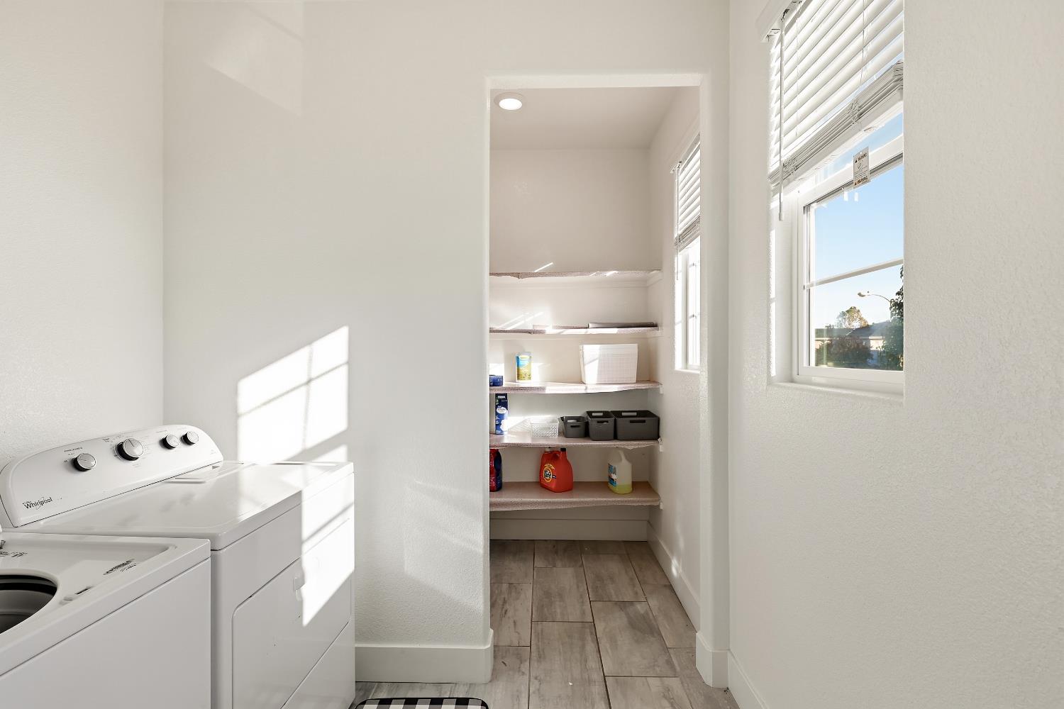 2367 Explorador Drive Merced, CA 95340 - Photo 30 of 42 a walk in closet with view of bedroom and wooden floor