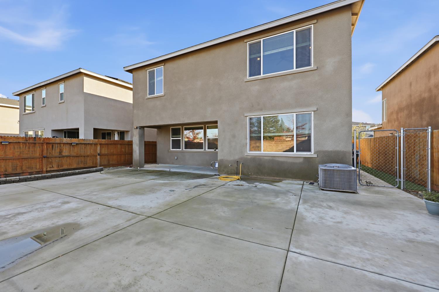 2367 Explorador Drive Merced, CA 95340 - Photo 36 of 42 a backyard of a house with oven and garage