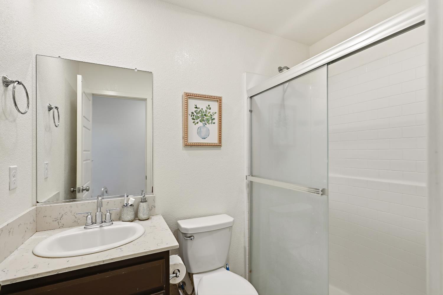 2367 Explorador Drive Merced, CA 95340 - Photo 7 of 42 a bathroom with a sink toilet and vanity