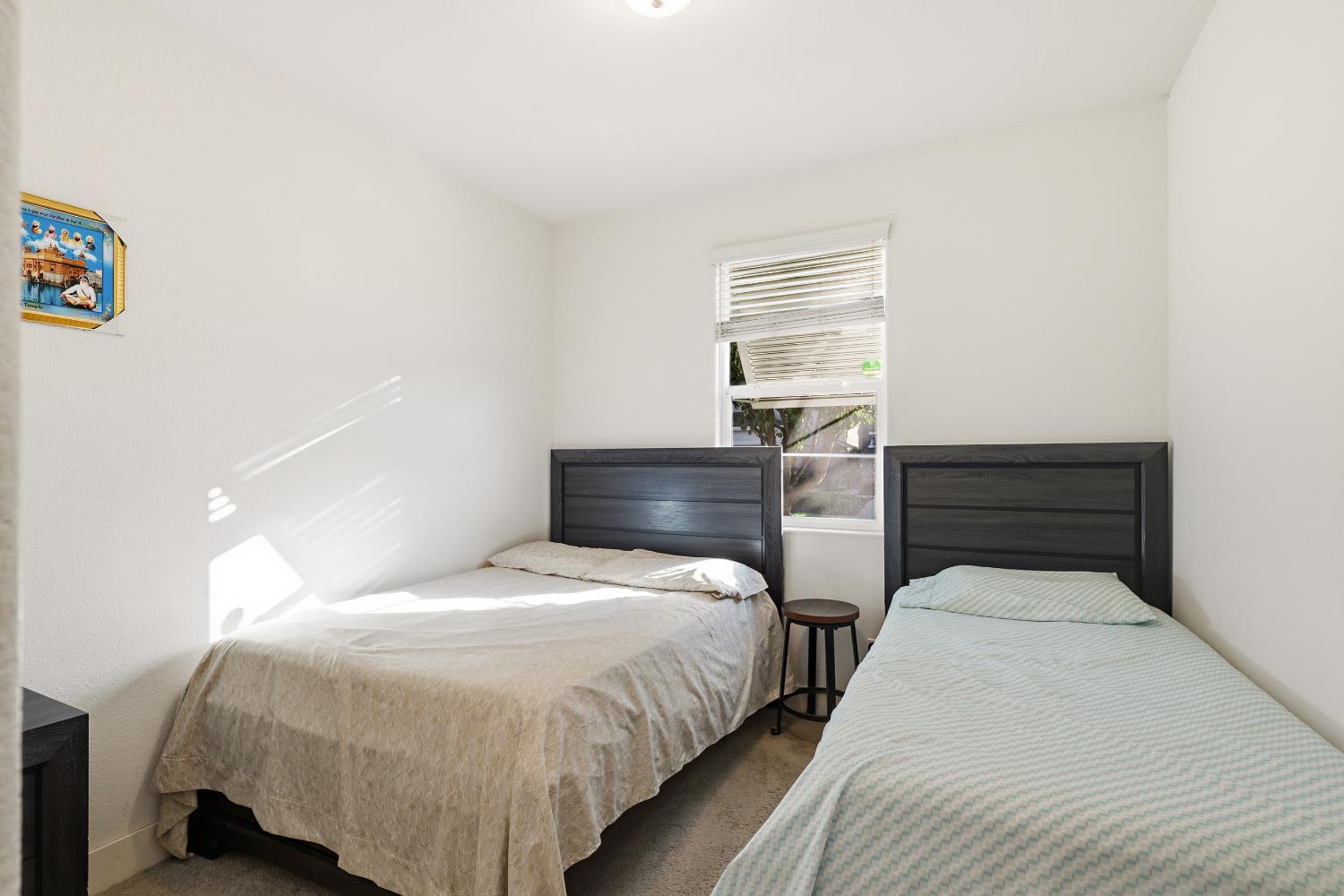 2367 Explorador Drive Merced, CA 95340 - Photo 8 of 42 a bedroom with bed and window