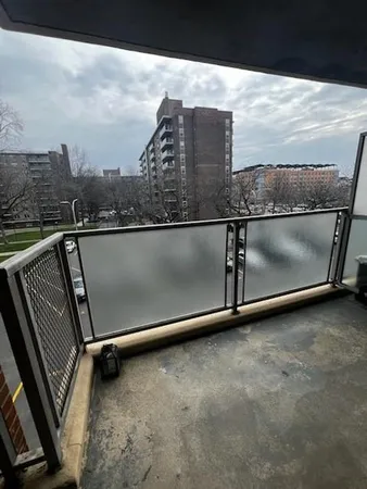 a view of balcony with furniture