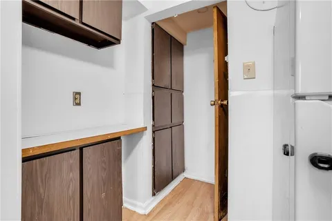 a kitchen with granite countertop a refrigerator and a sink