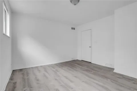 a spacious bathroom with a bathtub and shower