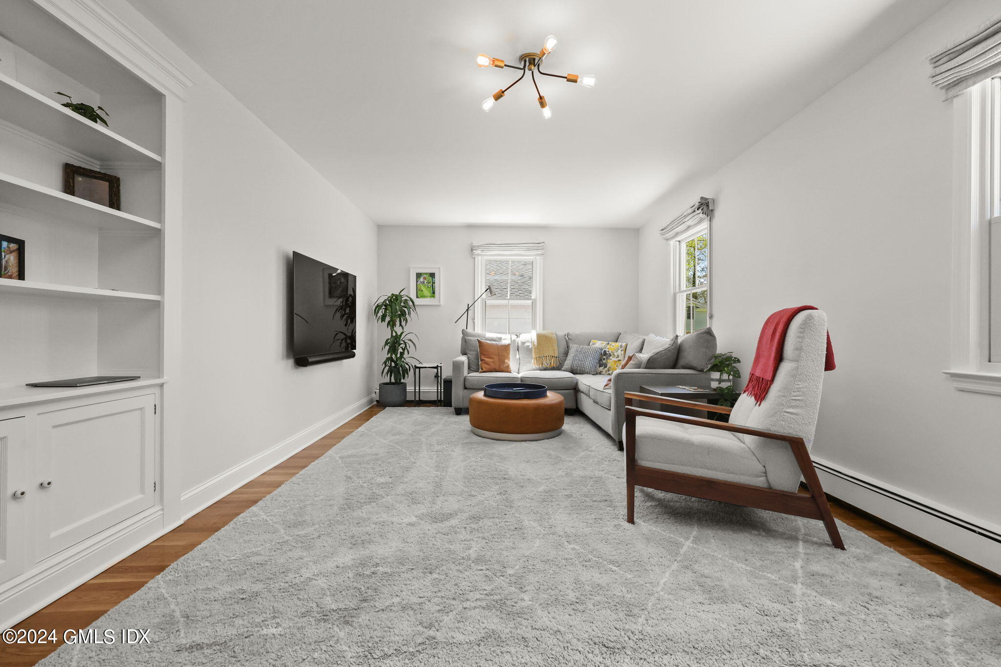 72 Lockwood Road Riverside, CT 06878 - Photo 16 of 51 a living room with furniture and a flat screen tv