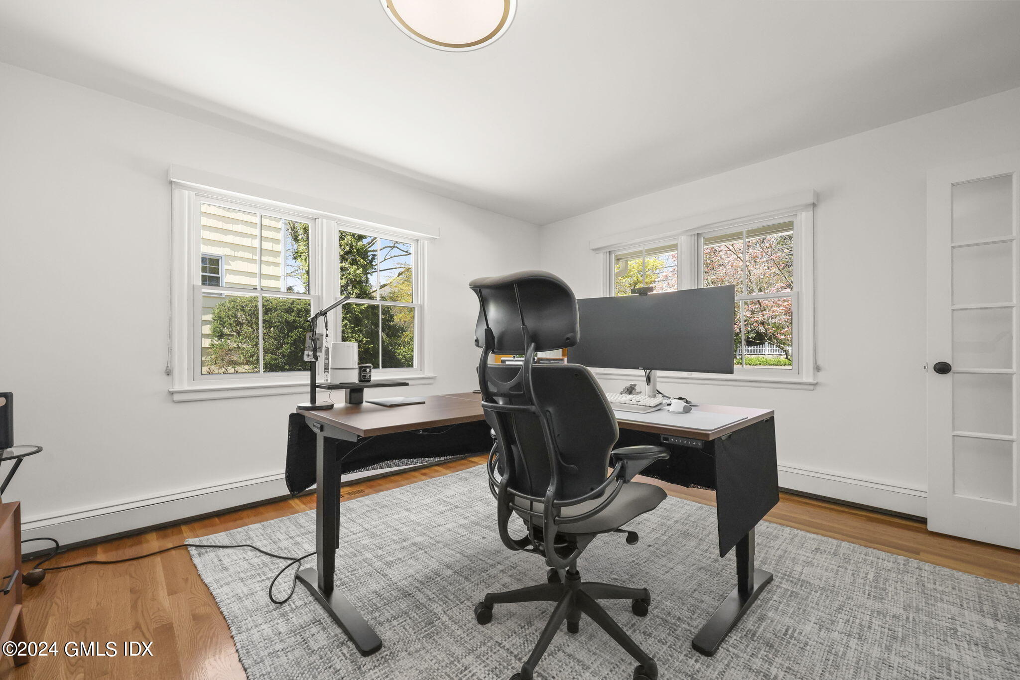 72 Lockwood Road Riverside, CT 06878 - Photo 21 of 51 a view of a workspace with furniture and a window
