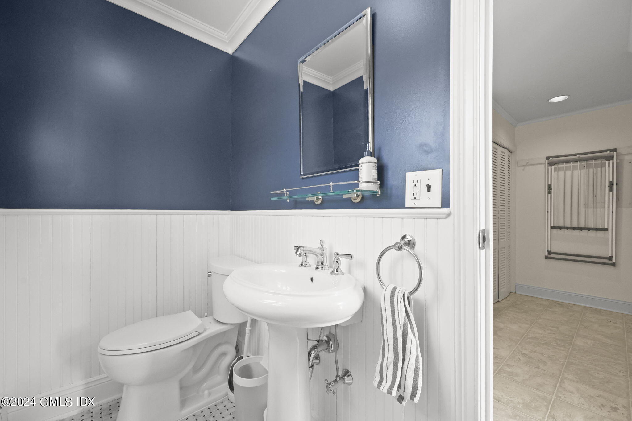 72 Lockwood Road Riverside, CT 06878 - Photo 22 of 51 a bathroom with a sink toilet and mirror