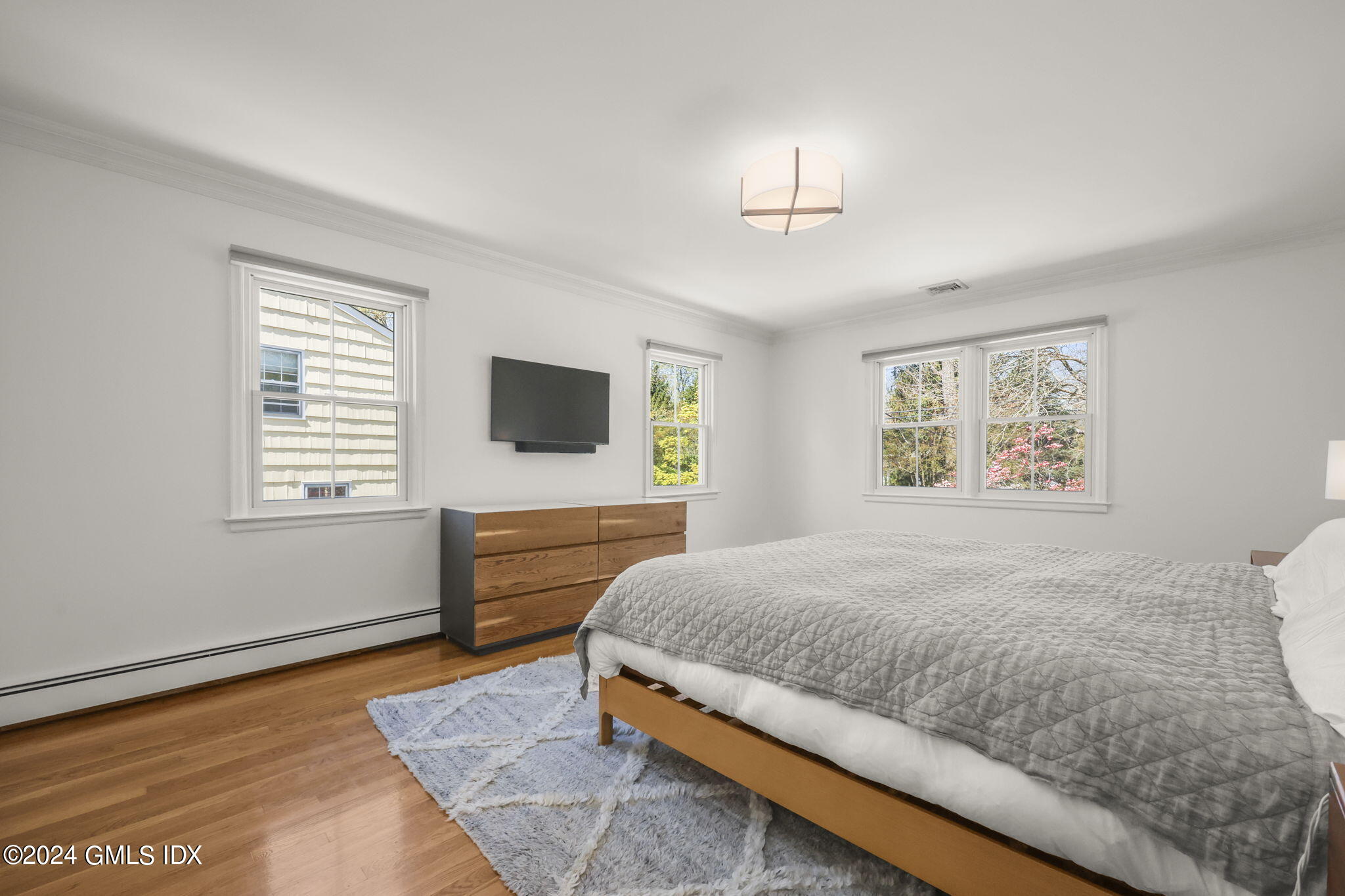 72 Lockwood Road Riverside, CT 06878 - Photo 24 of 51 a bedroom with a bed and a flat screen tv