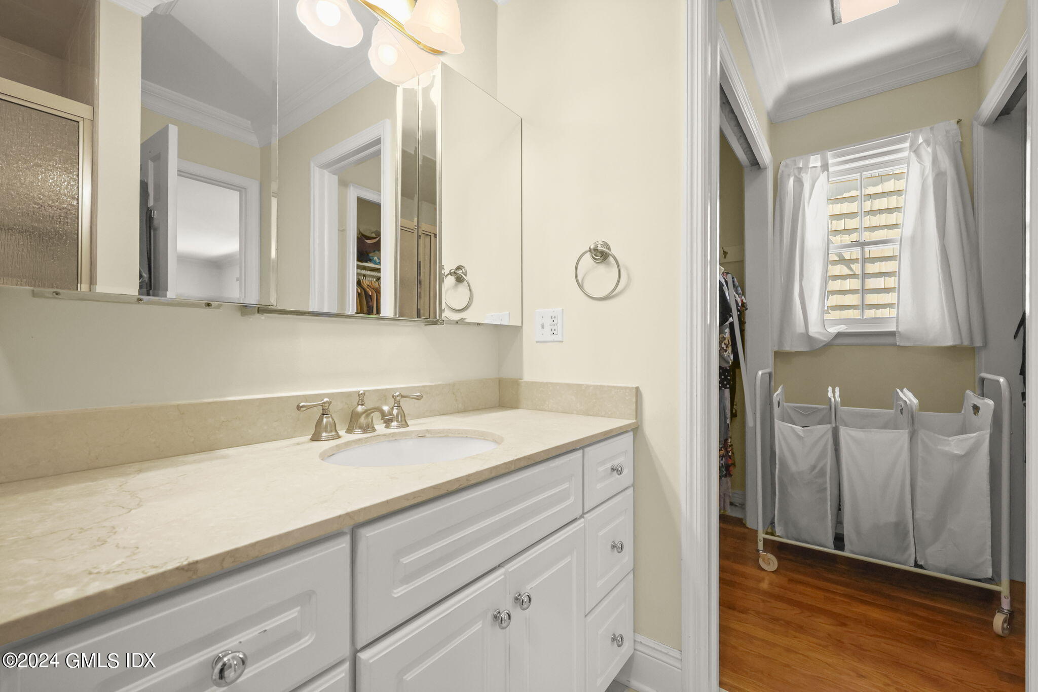 72 Lockwood Road Riverside, CT 06878 - Photo 28 of 51 a bathroom with a sink and a mirror