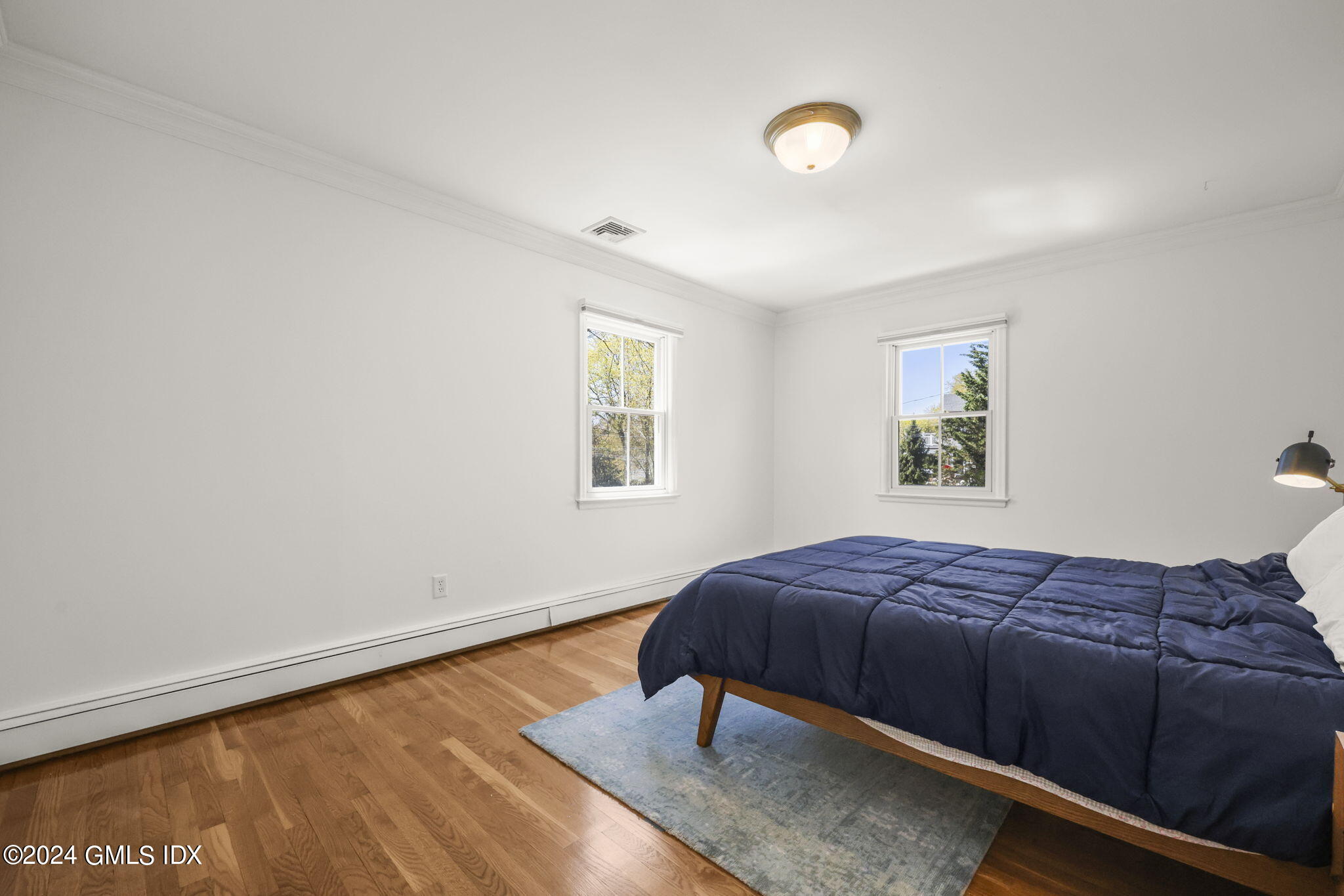 72 Lockwood Road Riverside, CT 06878 - Photo 30 of 51 a bedroom with a bed and a window