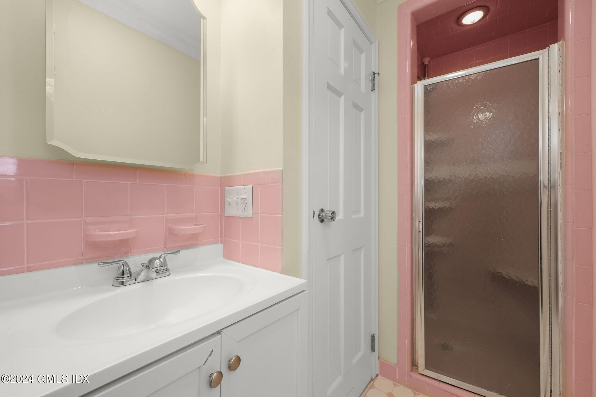 72 Lockwood Road Riverside, CT 06878 - Photo 32 of 51 a bathroom with a sink and a mirror