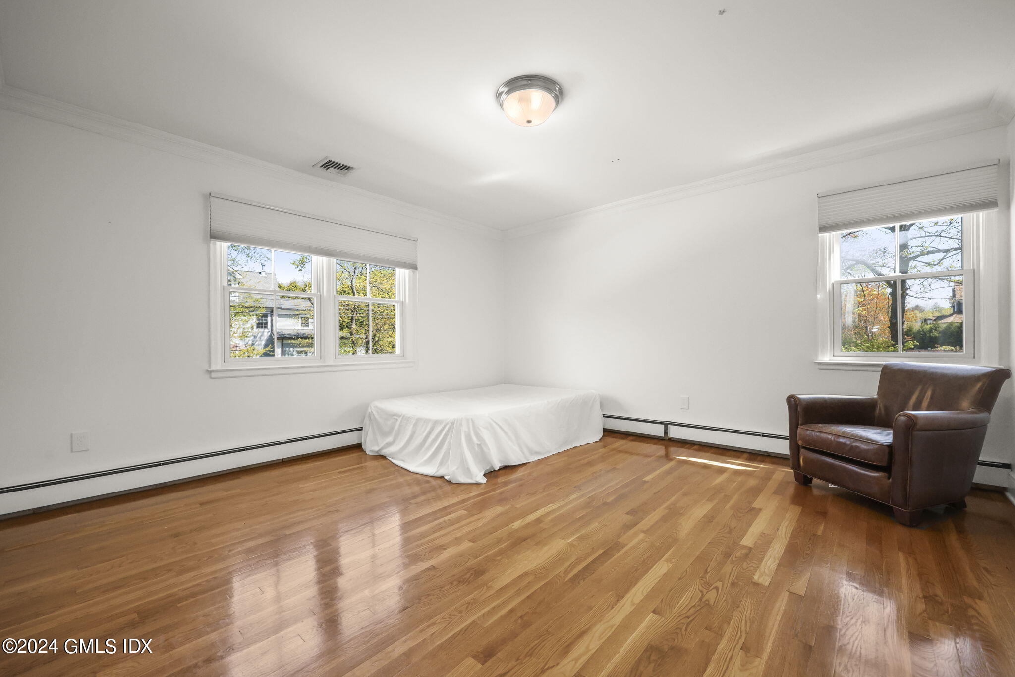 72 Lockwood Road Riverside, CT 06878 - Photo 36 of 51 a bedroom with a bed and a window