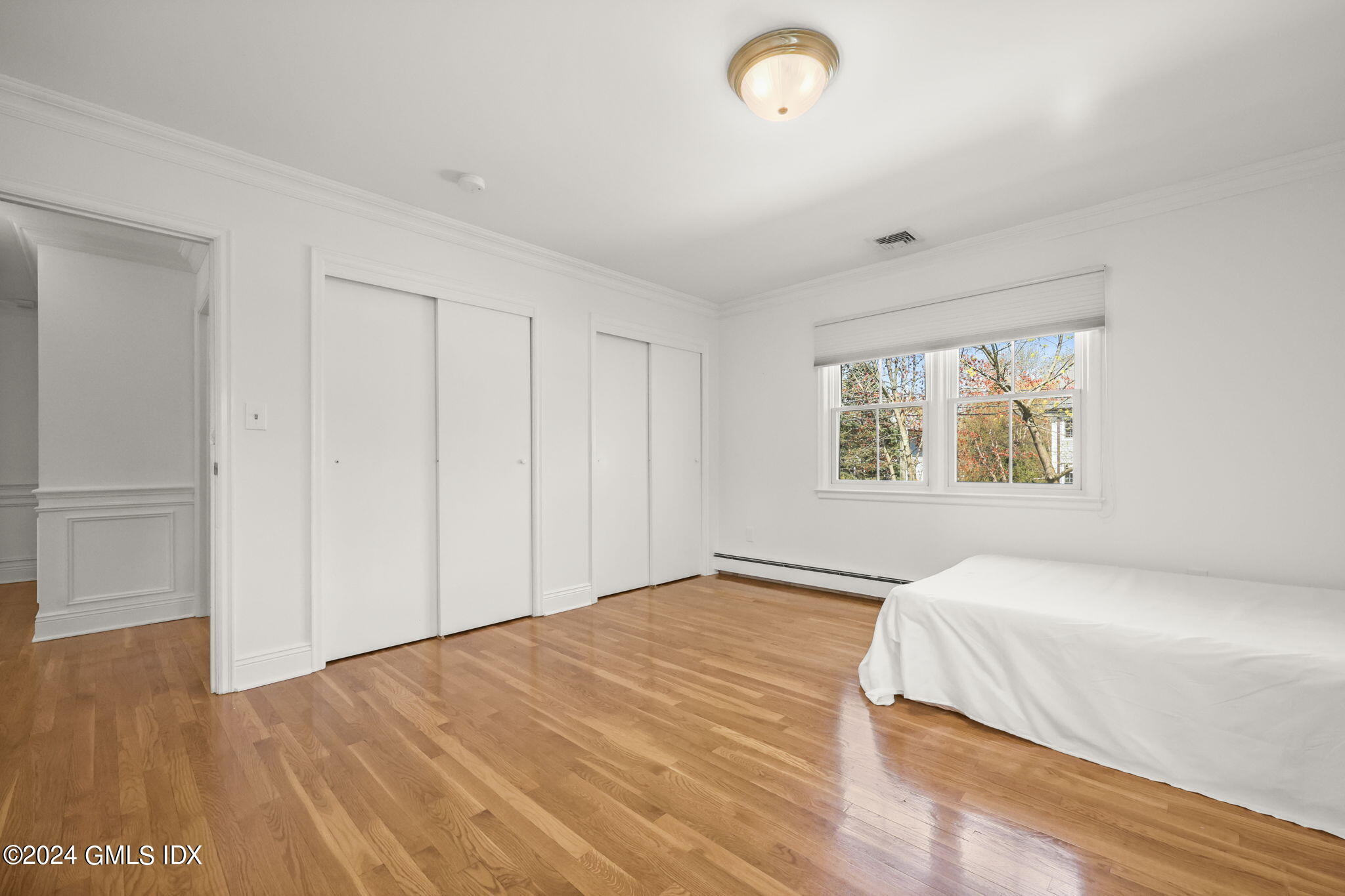 72 Lockwood Road Riverside, CT 06878 - Photo 37 of 51 a bedroom with a bed and a window