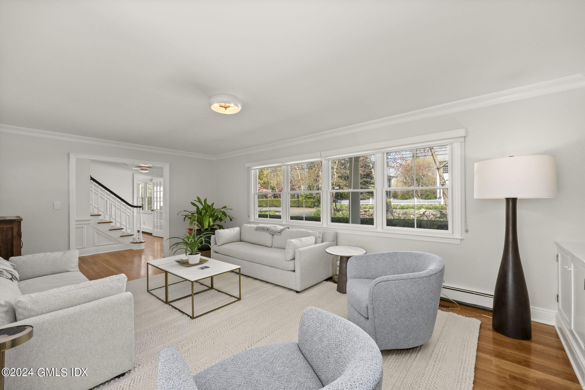 72 Lockwood Road Riverside, CT 06878 - Photo 4 of 51 a living room with furniture and a large window