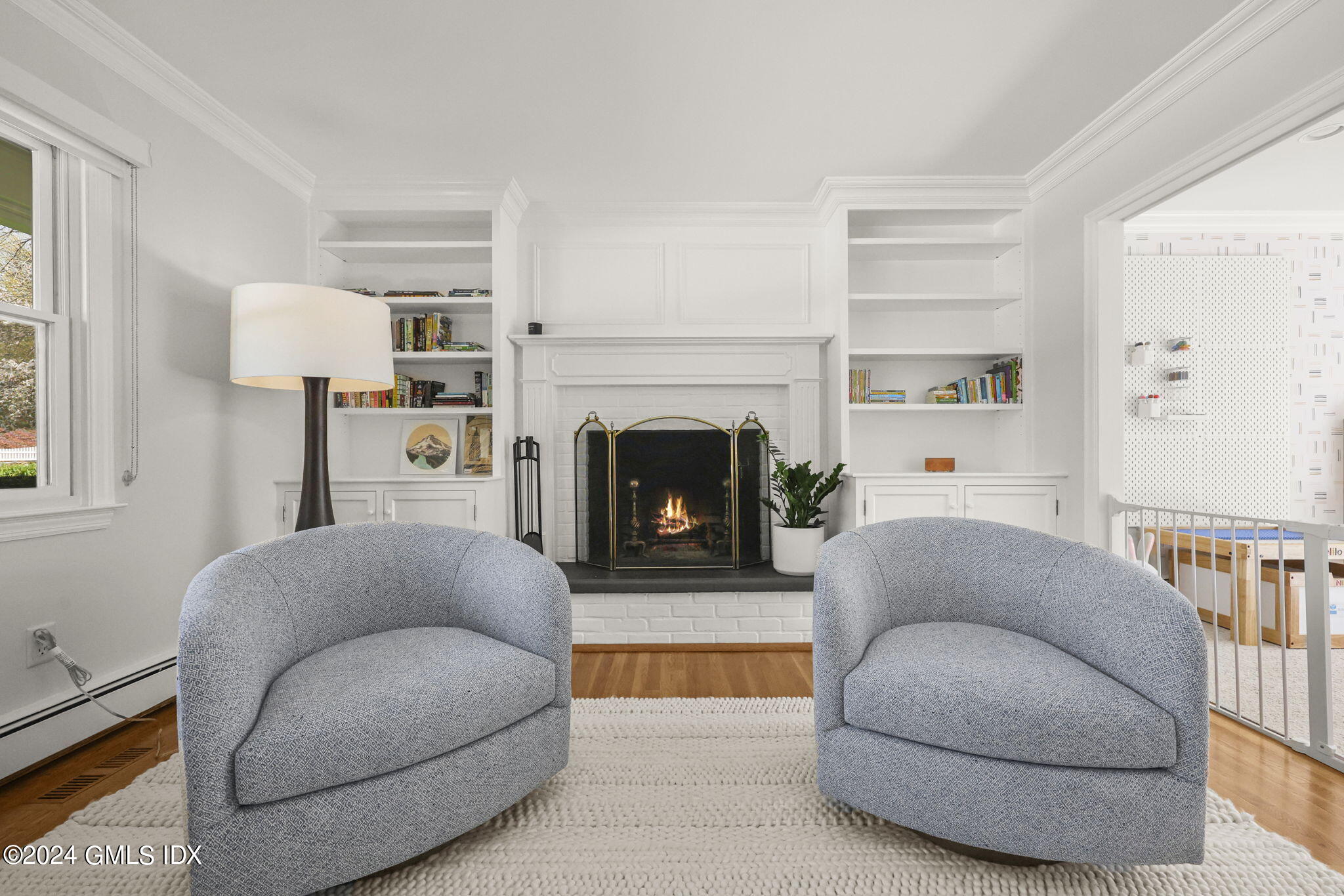 72 Lockwood Road Riverside, CT 06878 - Photo 6 of 51 a living room with furniture and a fireplace