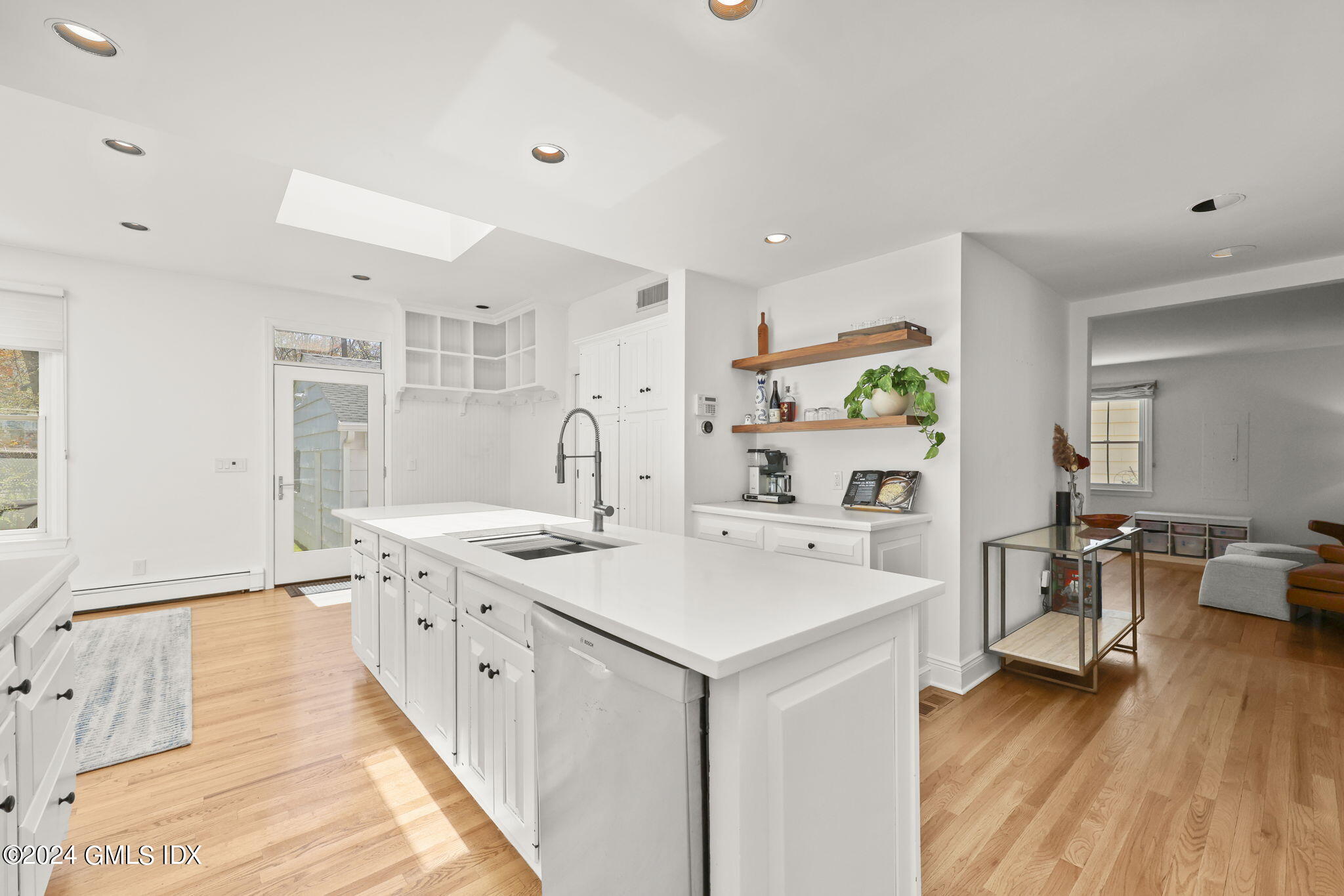 72 Lockwood Road Riverside, CT 06878 - Photo 8 of 51 a kitchen with a sink stove and wooden floor