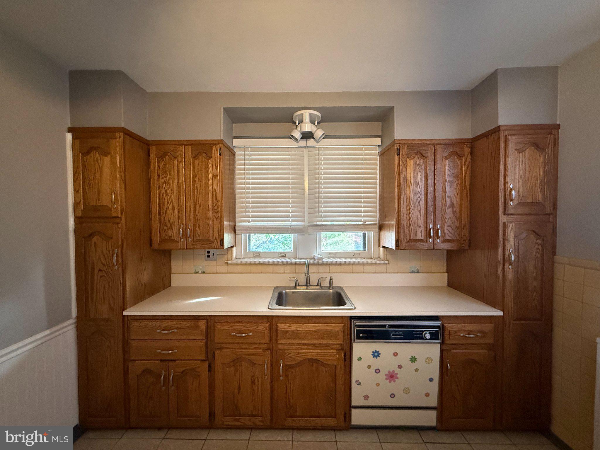 3148 Rawle Street Philadelphia, PA 19149 - Photo 9 of 33 Charming kitchen with oak cabinetry.