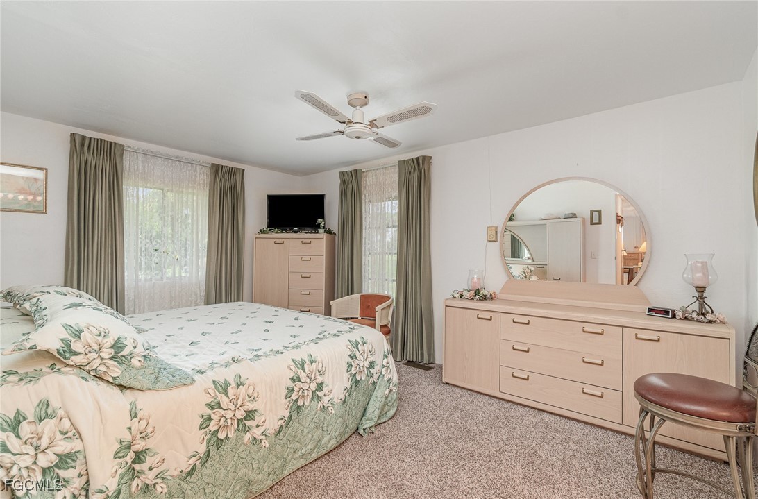 5 Aloe Alva, FL 33920 - Photo 12 of 37 a bedroom with a bed and a dresser