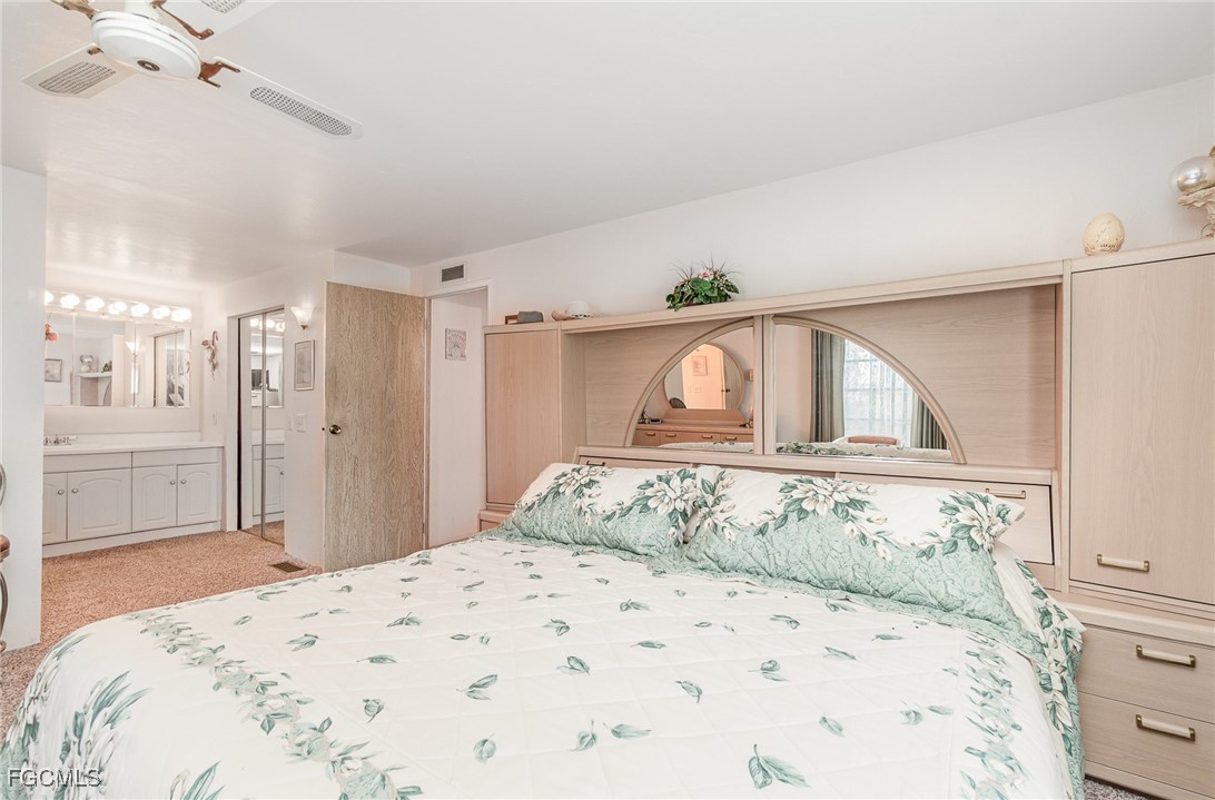 5 Aloe Alva, FL 33920 - Photo 13 of 37 a bedroom with a large bed and a window