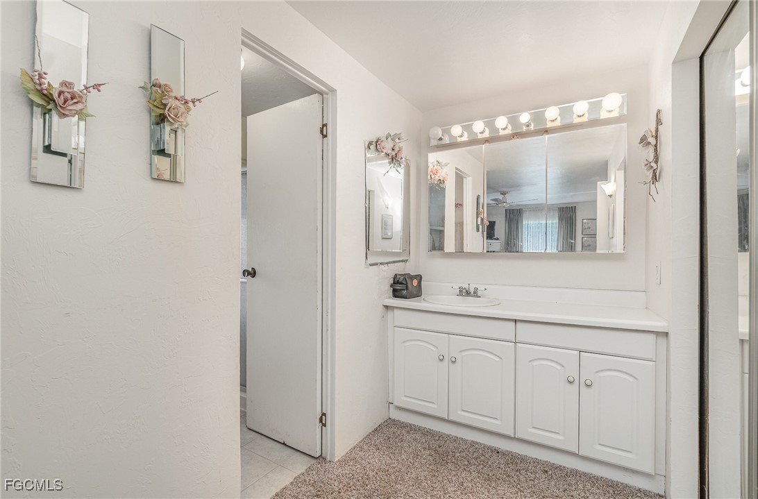 5 Aloe Alva, FL 33920 - Photo 14 of 37 a bathroom with a double vanity sink mirror and