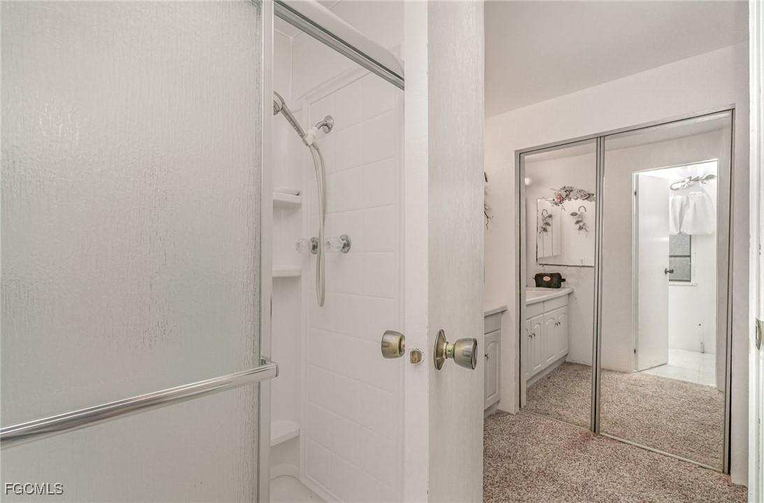 5 Aloe Alva, FL 33920 - Photo 15 of 37 a bathroom with a shower and a glass door