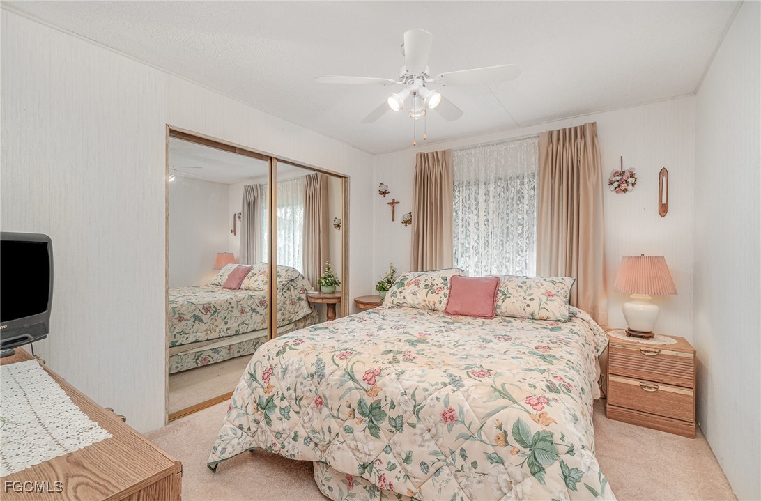 5 Aloe Alva, FL 33920 - Photo 16 of 37 a bedroom with a bed and a television