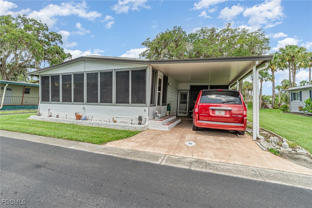 5 Aloe Alva, FL 33920 - Photo 2 of 37 a house view with a sitting space and garden