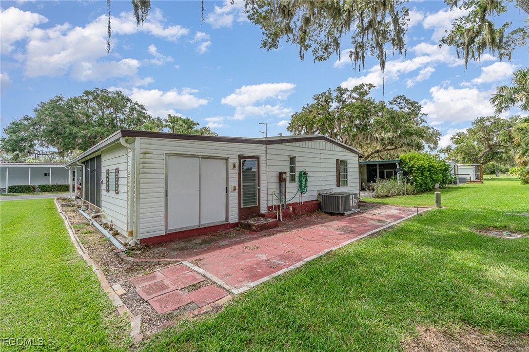 5 Aloe Alva, FL 33920 - Photo 26 of 37 a view of a house with backyard and a tree