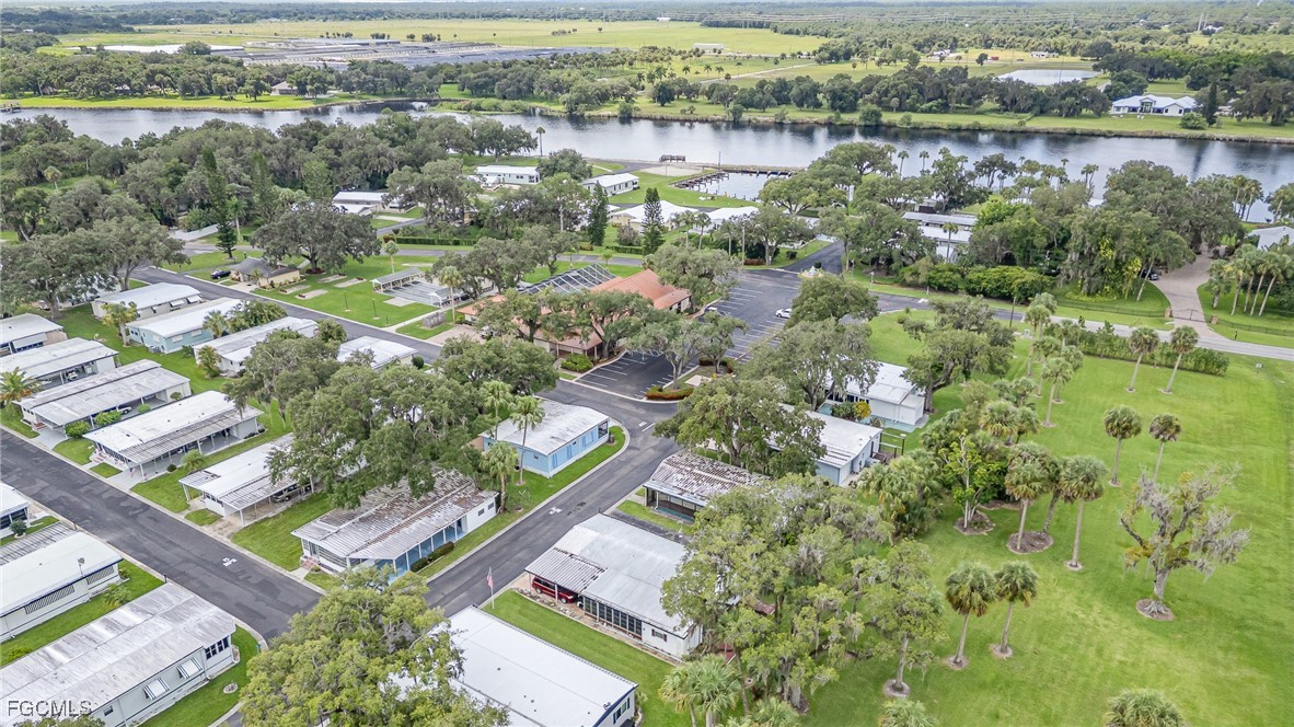 5 Aloe Alva, FL 33920 - Photo 31 of 37 an aerial view of residential houses with outdoor space and lake view
