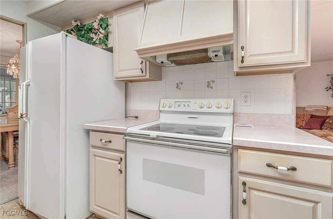 5 Aloe Alva, FL 33920 - Photo 9 of 37 a kitchen with stainless steel appliances white cabinets and a refrigerator