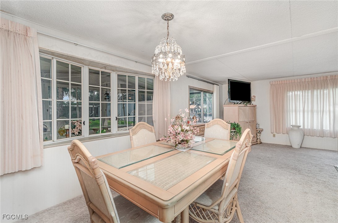 5 Aloe Alva, FL 33920 - Photo 10 of 37 a view of a dining room with furniture window and outside view