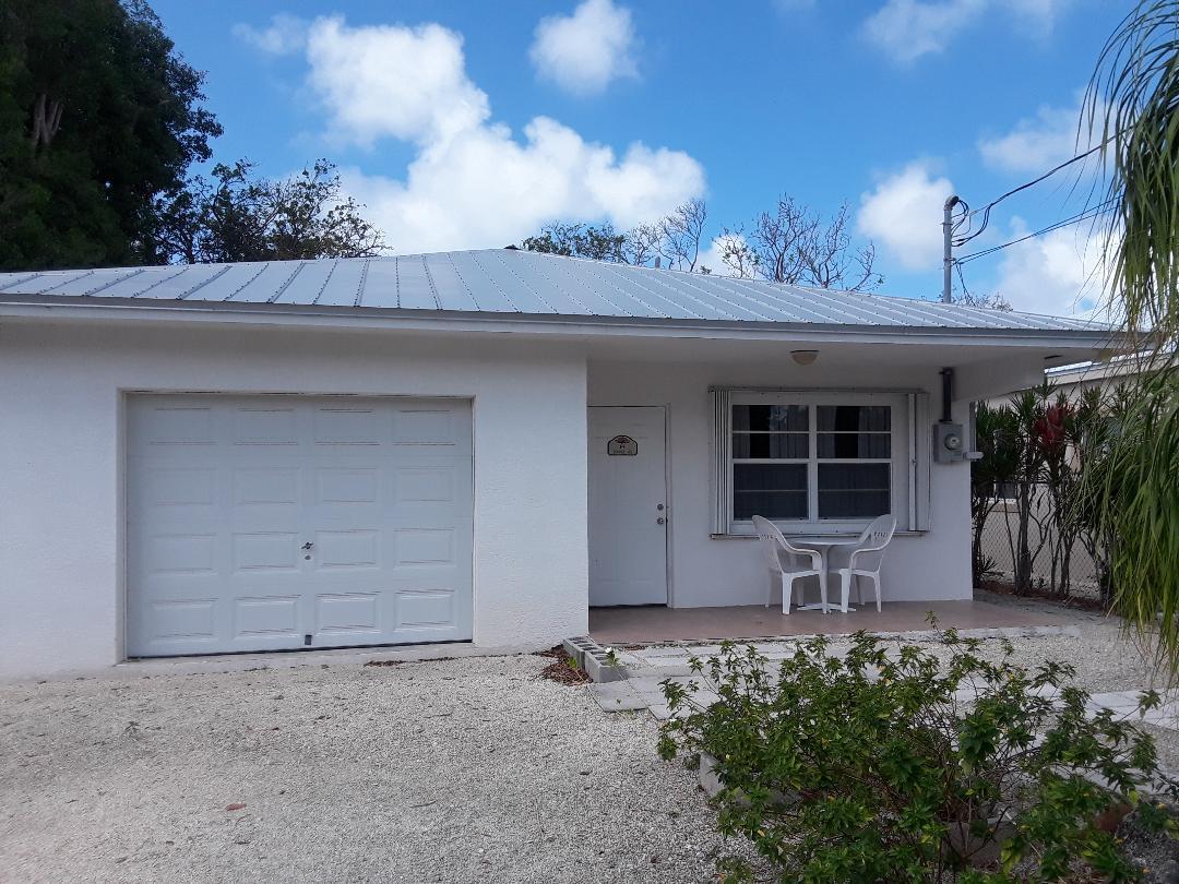 14 Jewfish Avenue Key Largo, FL 33037 - Photo 1 of 44 a front view of a house with garden