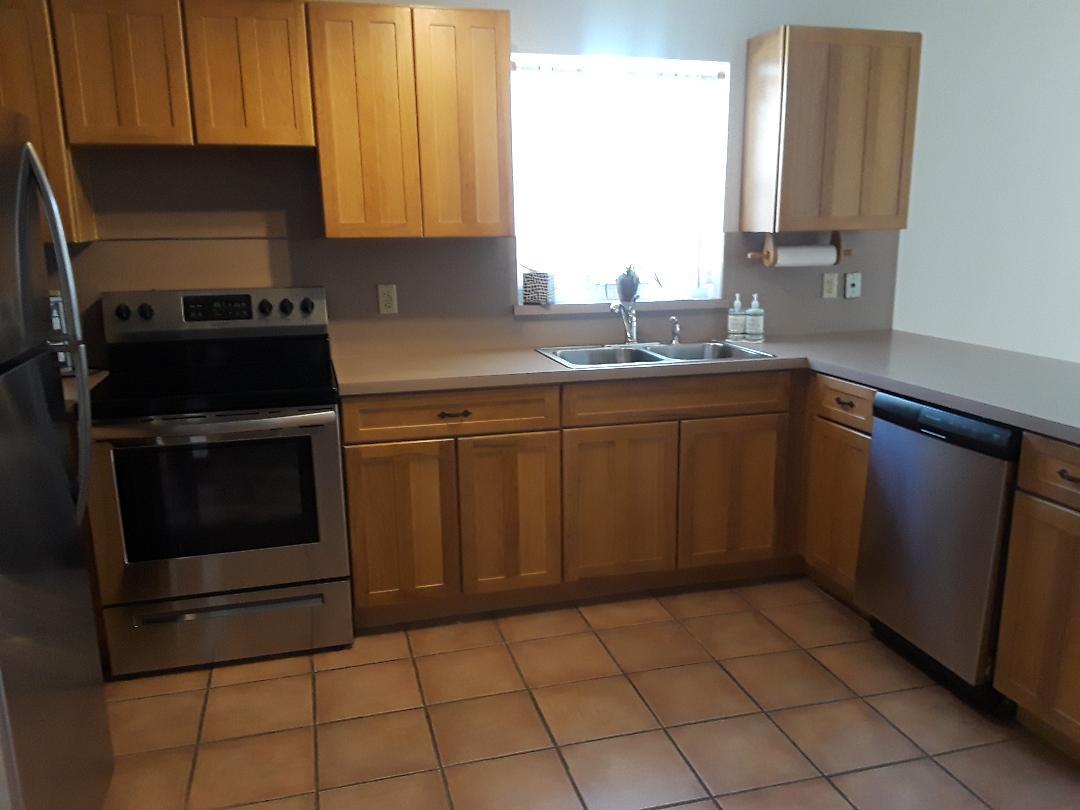 14 Jewfish Avenue Key Largo, FL 33037 - Photo 13 of 44 a kitchen with a sink and cabinets