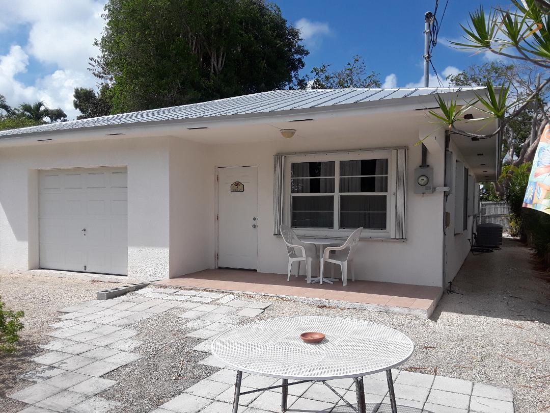 14 Jewfish Avenue Key Largo, FL 33037 - Photo 3 of 44 a view of a house with backyard and sitting area