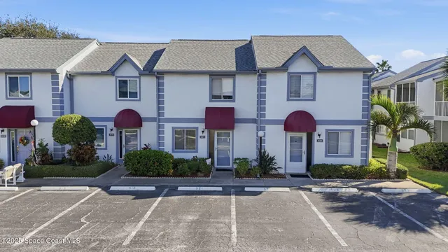 a front view of a house with yard