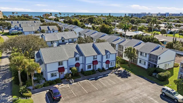 a view of a house with a tree