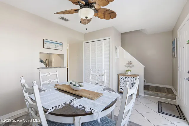 a bathroom with a sink vanity granite tub and a mirror