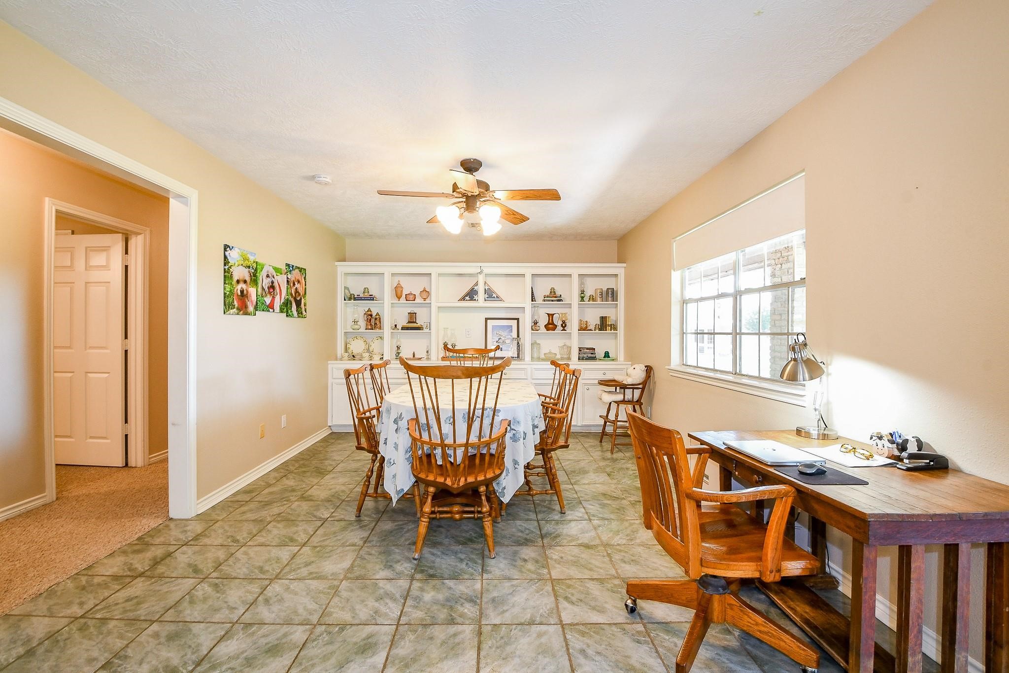 22035 Buescher Road Tomball, TX 77377 - Photo 37 of 43 a view of a dining room with furniture and a chandelier