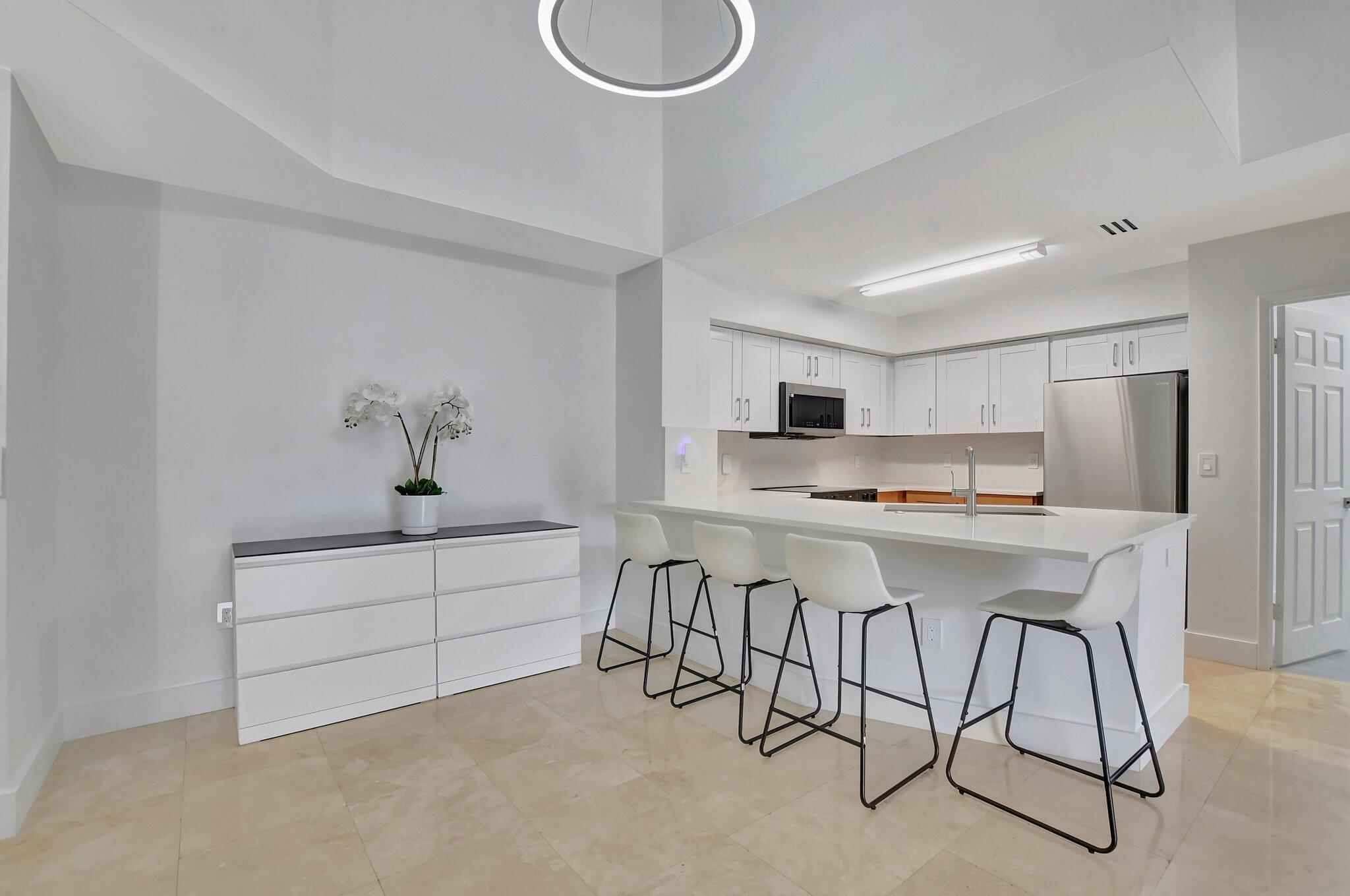 3209 Clint Moore Road, Unit 205 Boca Raton, FL 33496 - Photo 1 of 46 Quartz Breakfast Bar