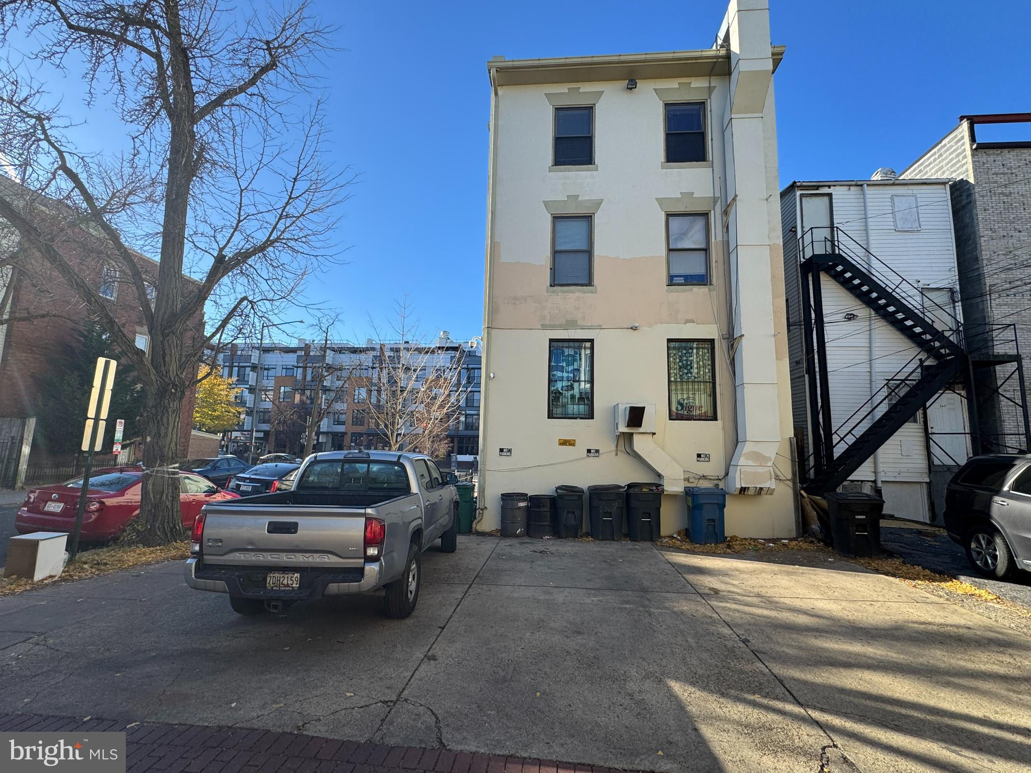3445 14th Street Northwest, Unit 3 Washington, DC 20010 - Photo 14 of 15 a couple of cars parked in front of a house