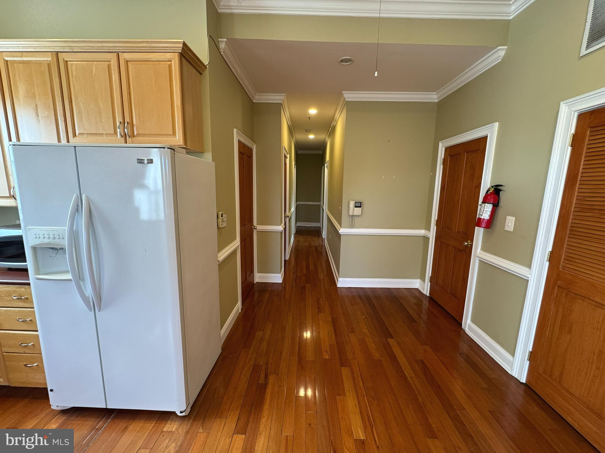 3445 14th Street Northwest, Unit 3 Washington, DC 20010 - Photo 4 of 15 a view of wooden floor and windows in a room
