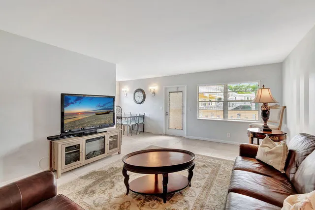 a kitchen with stainless steel appliances granite countertop a stove microwave and cabinets